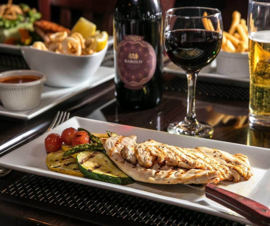 Pollo alla Griglia  · Grilled chicken breast served with grilled vegetables.