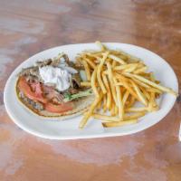 Gyro Sandwich Combo · Sliced thin seasoned beef and lamb mix on a rotisserie. Served with fresh lettuce, tomato, o...