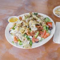 Chicken Gyro Salad · Low calorie marinated frilled chicken tenders. Served on fresh lettuce with pita bread and h...