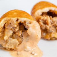 3 Cheesesteak Minis · Philly cheesesteak, fried onions and 3-cheese sauce fried to a crispy golden brown.