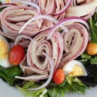 Chef Salad · Mixed greens, tomatoes, onion, ham, salami, turkey, provolone and egg.