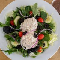 Tuna Salad · On a bed of mixed greens, cucumbers, red onions, black olives and tomatoes.