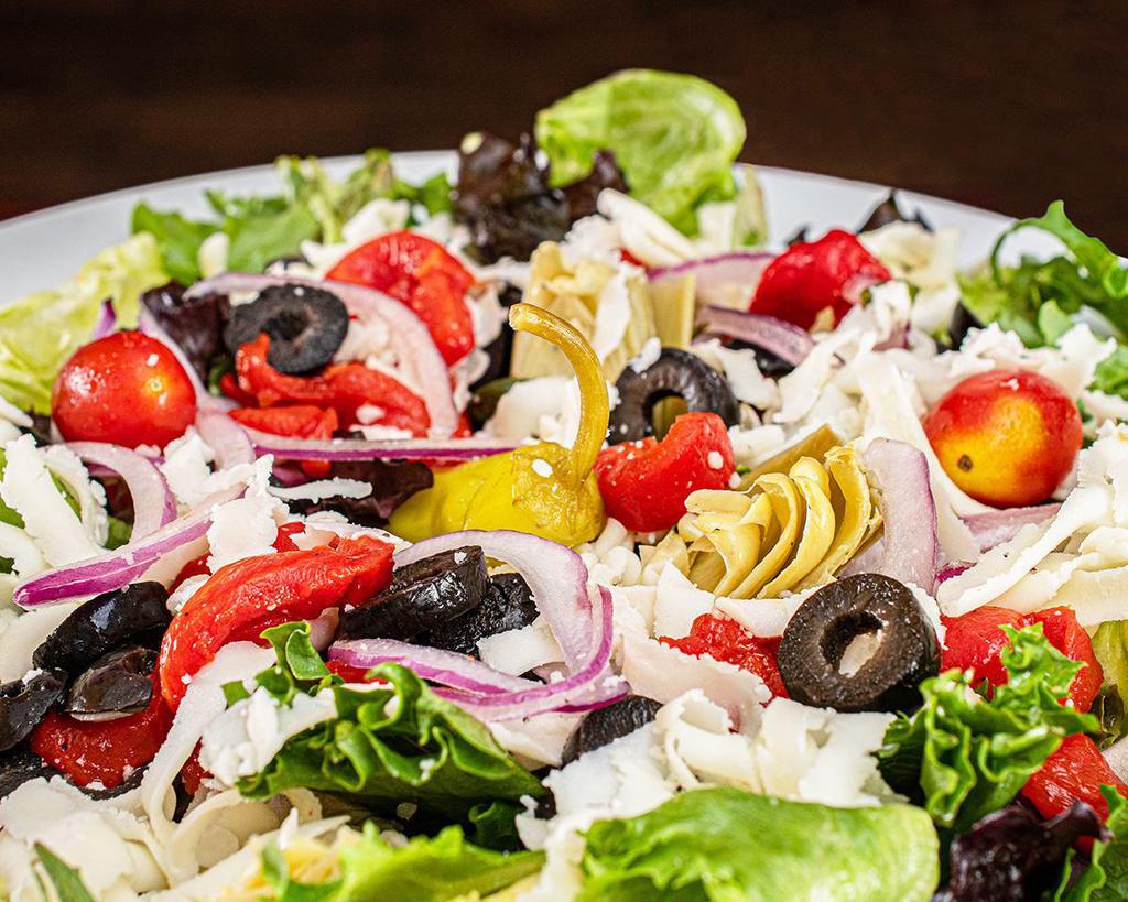 Specialty House Salad · Mixed greens, roasted peppers, olives, artichokes, tomatoes, red onions, mozzarella cheese and balsamic vinaigrette.