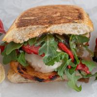 The Grilled Chicken Panini · Fresh mozzarella, roasted peppers, arugula and balsamic vinaigrette.