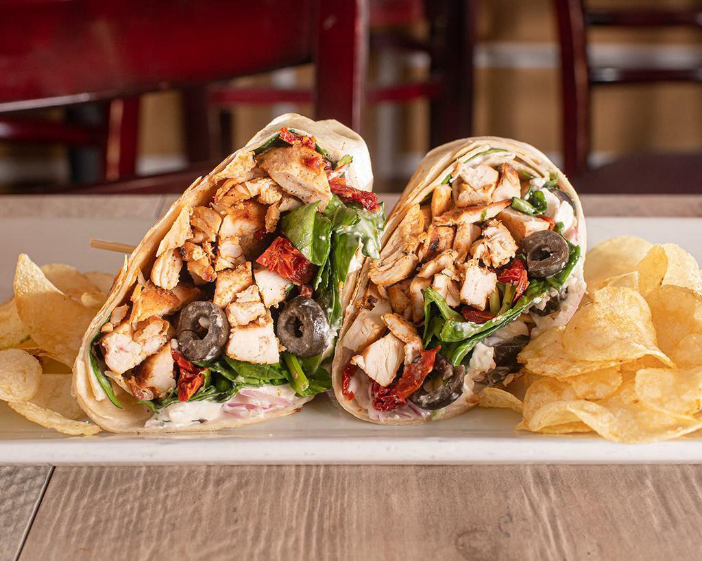 Greek Wrap · Grilled chicken, olives, sun-dried tomatoes, feta cheese, red onions, spinach and bleu cheese vinaigrette.