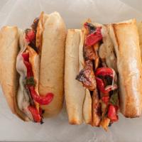 Grilled Chicken Portobello Sandwich · Roasted peppers, provolone cheese and balsamic vinaigrette.