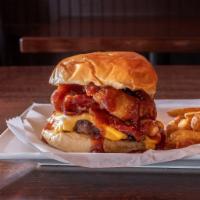 Cowboy Burger · Bacon, American cheese, onion rings and BBQ sauce.