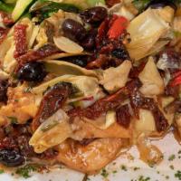 Chicken Romano · Sun-dried tomatoes, artichoke hearts, olives, roasted peppers and white wine with sauteed ve...