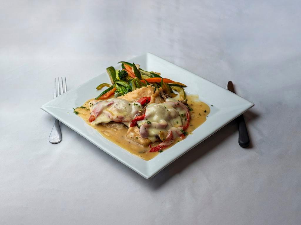 Chicken Luca · In a garlic wine sauce, topped with grilled eggplant, roasted peppers and provolone with sauteed vegetables.