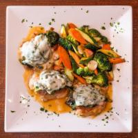Veal Saltimbocca · Topped with prosciutto, spinach and mozzarella with sauteed vegetables.