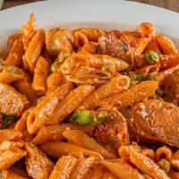 Penne Arrabbiata · Sausage, hot peppers and peas in a pink cream sauce.