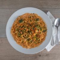 Spaghetti Primavera · Served in a tomato cream sauce, carrots, broccoli, zucchini and peas.