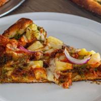 Il Diablo Pizza · Pesto base, mozzarella,  Buffalo chicken, bacon, pineapples and red onions.
