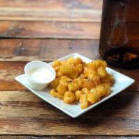 Wisconsin Curds · Authentic curds with Radeberger pilsner batter. Served with Ranch