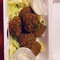 Falafel · Garbanzo beans blended with onions, cilantro, parsley, and Mediterranean spices. Vegetarian.