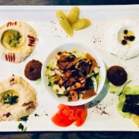 Vegetarian Mixed Appetizers · Combination of hummus, labneh, baba ghanouj, grape leaves, Falafel and fatoush Organic.  Veg...