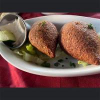 Fried Kibbeh · Finely ground bulgur wheat mixed with ground beef and filled with seasoned beef and onion fi...