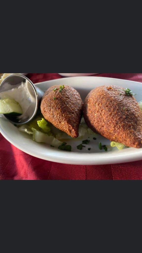 Fried Kibbeh · Finely ground bulgur wheat mixed with ground beef and filled with seasoned beef and onion filling.