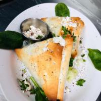Spanakopita · Baked phyllo dough with fresh spinach and feta. Vegetarian.