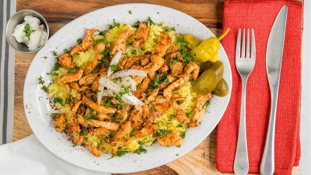 Chicken Shawarma Platter · Shredded marinated chicken, topped with onions and parsley. Served with rice and garlic paste.