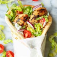 Chicken Gyro Wrap · Chicken Gyro, combined with herbs accompanied by fresh tomatoes, Cucumber, onions and tzatzi...
