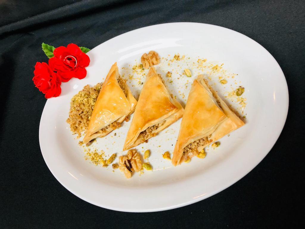 Baklava · Traditional homemade pastries filled with nuts, pistachios and almonds.