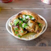 Chicken Kabob Sandwich · Prepared in a freshly-baked pita bread, filled with chicken kabob, hummus, salad, pickles, a...