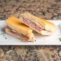 26. Cubano Especial · Special Cuban sandwich. Ham, cheese and pork.