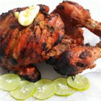 Tandoori Chicken Whole  · A whole chicken marinated overnight and cooked in a tandoor (Clay Oven). Serves with rice, d...