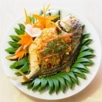 62. Spicy Fish  · Pla Rad Prix. Deep fried fillet fresh fish white ocean with garlic chili sauce, onion green ...