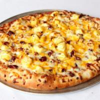 Hawaiian Sunrise Gourmet Pizza · Ham, pineapple, roasted cashews, sun-dried cranberries with mozzarella and cheddar cheese.