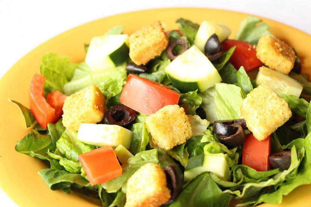 Dinner Salad · Lettuce, tomatoes, cucumber, black olives and crotons with your choice of dressing