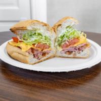 Hambino Specialty Sandwich · Maple honey ham, bacon and American cheese, topped with lettuce, tomatoes, and ranch dressin...