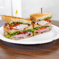 Empire Specialty Sandwich · Classic triple decker with turkey, ham and bacon, topped with lettuce, tomatoes, mayonnaise,...