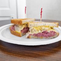 Reuben Specialty Sandwich · Corned beef, sauerkraut and Swiss cheese, topped with spicy mustard, served hot on rye bread.