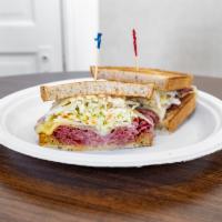 New Yorker Specialty Sandwich · Pastrami and swiss cheese, topped with Russian dressing and cole slaw, served hot on rye bre...