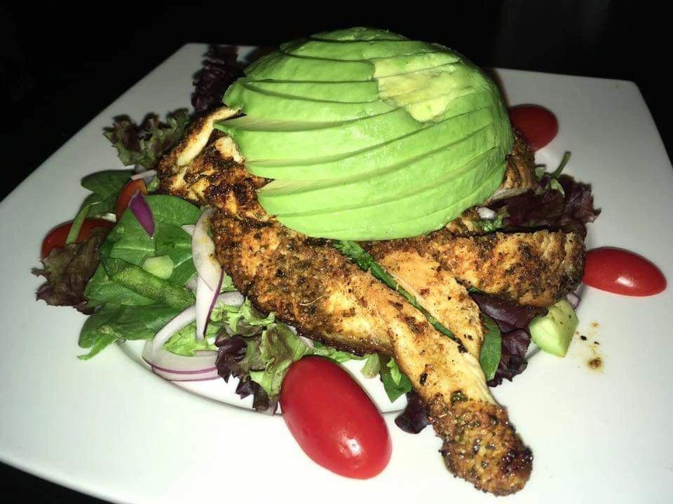 Blackened chicken avocado salad · Served over romaine  tomatoes, cucumber, red onion, with a house made balsamic dressing on the side