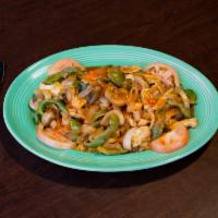 Arroz con Pollo · Tender sliced chicken breast specially prepared with fresh mushrooms, onions, green peppers....