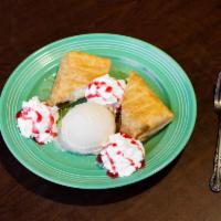 Chimicheesecake · Cheesecake inside of a flour tortilla, lightly fried and served with a scoop of vanilla ice ...