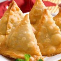 6. Vegetable Samosa  · 2 crispy puffs filled with potatoes and peas. Vegan.