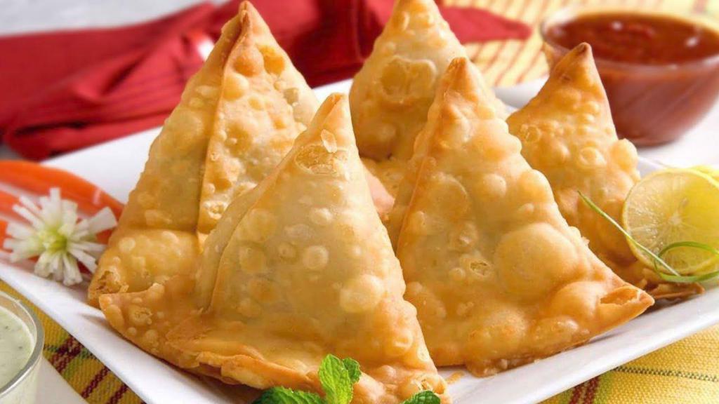 6. Vegetable Samosa  · 2 crispy puffs filled with potatoes and peas. Vegan.
