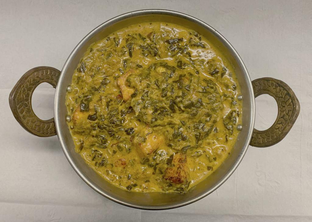 80. Palak Paneer · Tender spinach and cubed farmer's cheese cooked with spices.