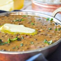 82. Dal Makhani · Black lentils and kidney beans cooked in a buttery sauce with onions and Indian spices.