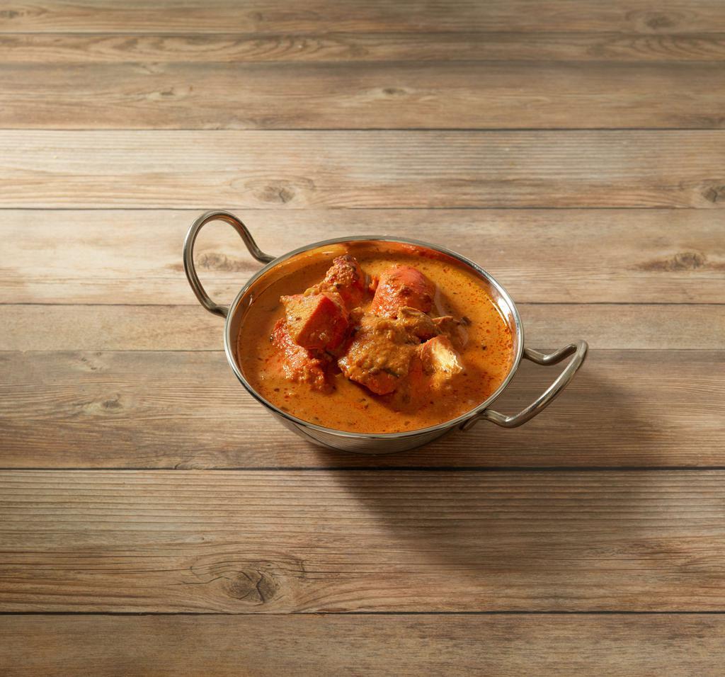 100. Chicken Tikka Masala · Chicken breast cooked in a clay oven with a unique blend of spices, tomatoes and onions in a creamy sauce.