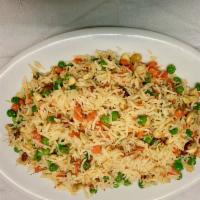 Pulaw Rice · Basmati rice sauteed with cashew, raisins and cooked with peas and spices.