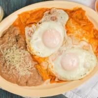 Chilaquiles · W /, refried beans , Cheese ,Onion add your choice of meat for an additional amount 