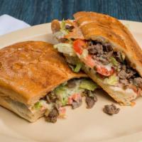 Tortas · Mexican style sandwich with choice of meat, cheese, sour cream, guacamole, salsa, lettuce an...