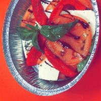 Mozzarella Caprese Appetizer · Layered fresh mozzarella, tomato, roasted red peppers and basil with balsamic glaze.