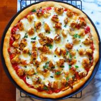 Chicken Parmesan Pizza · Crispy chicken, tomato sauce and mozzarella cheese.