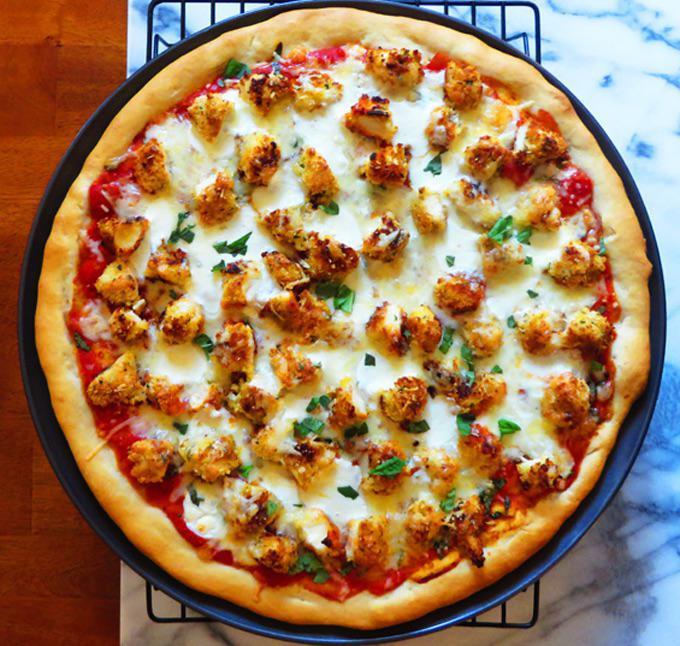 Chicken Parmesan Pizza · Crispy chicken, tomato sauce and mozzarella cheese.